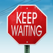 A Keep Waiting Sign