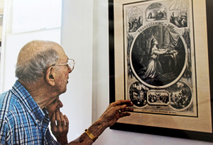 John Adler and his sister look at Harper's Weekly illustration in the Jay Mansion