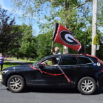 Rye Middle School Graduation Car Parade June 2020 Holding the Garnet Flag High