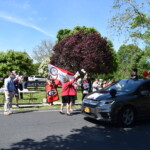 Rye Middle School Graduation Car Parade June 2020 Principal Ann Edwards tosses a graduation t shirt