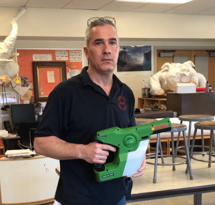 Midland School custodian Pete with electrostatic sprayer SQUARE