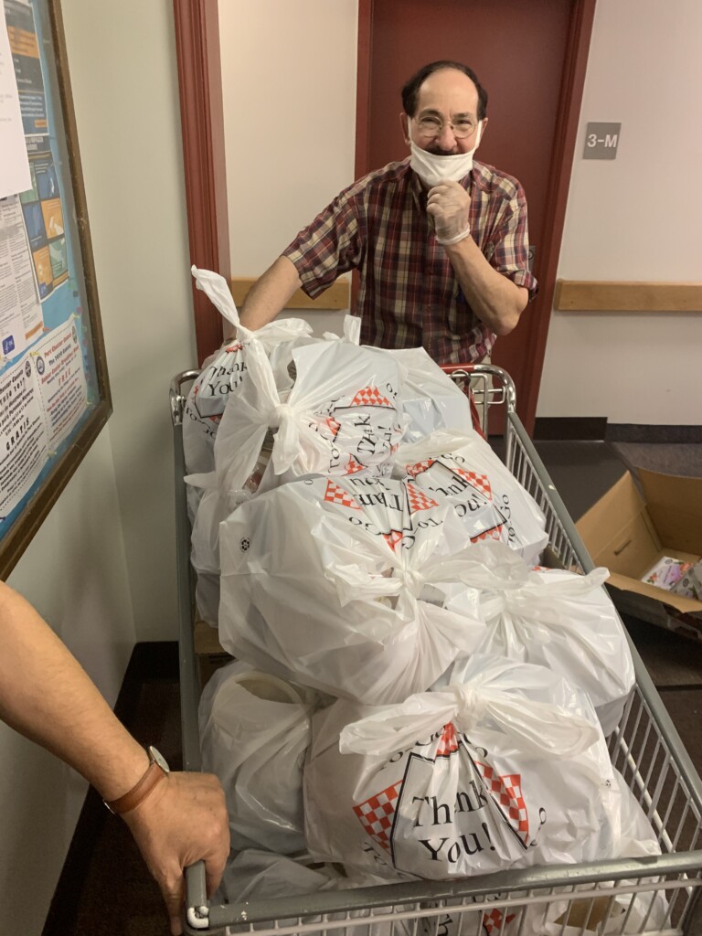 Juan delivering the meals to elderly residents in his building - 1