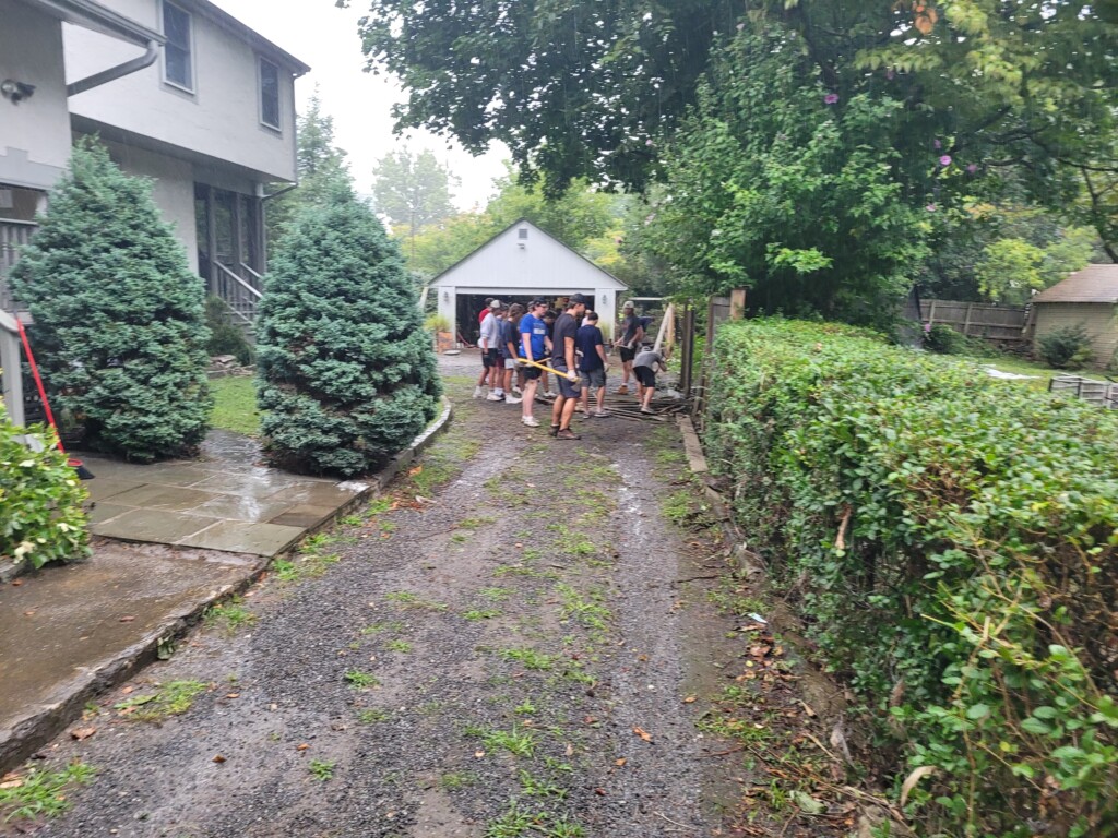 Kirby House cleanup - Hurricane Ida September 2021 - football team