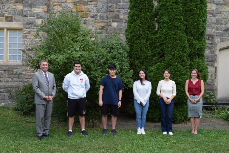 (PHOTO: Students with Merit. (Left to right) Superintendent Dr. Eric Byrne, Luke Lepore, Sean Yu, Lainey Noga, Sophie Molitor, and Rye High School Principal Suzanne Short.)