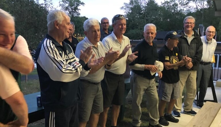 (PHOTO: Rye Veterans leading the audience of 150 in the Pledge of Allegiance. Left to Right: Hank Birdsall, Charlie Rosabella, Tim Moynihan Tom Bassista, Vinnie Ballantoni, Jim Dianni, Frank Harrigan.)