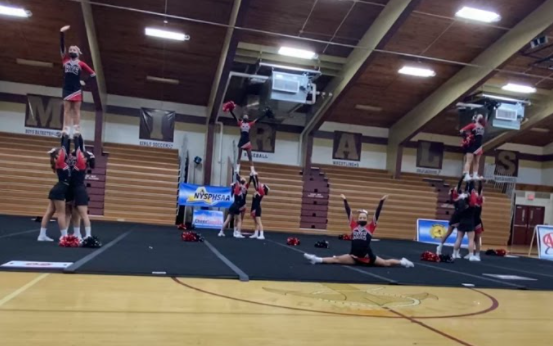 (PHOTO: Rye Girls Varsity Cheerleaders in stunt mode... at the Regional Game Day Championship on October 30, 2021 at Arlington High School.)