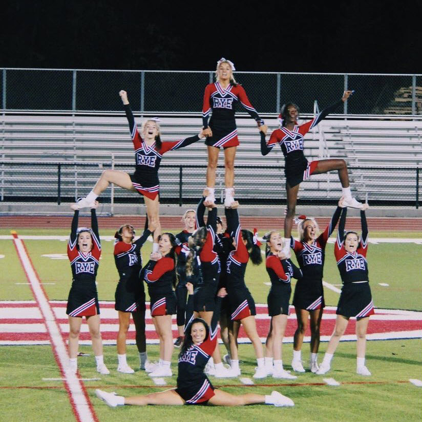 (PHOTO: Rye Girls Varsity Cheerleading at the pep rally on Friday, October 1st.)