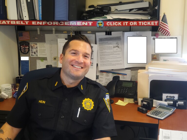 (PHOTO: Rye PD Lieutenant Al Hein at his desk.)