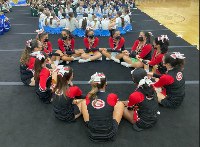 (PHOTO: Rye Girls Varsity Cheerleaders waiting for the results at the Regional Game Day Championship on October 30, 2021 at Arlington High School.)