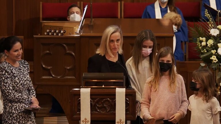 (PHOTO: Dr. Genevieve Weber accepted the 2021 John Carey Award for Human Rights, individual category. She was accompanied by her three daughters.)