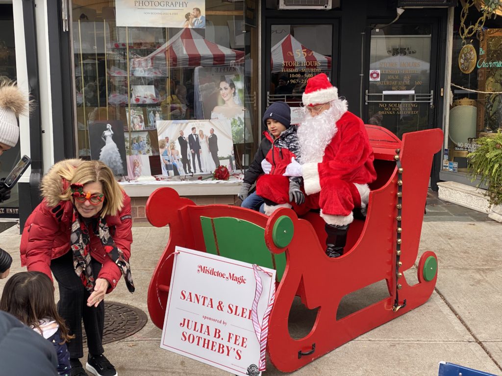(PHOTO: Real estate agents at Julia B. Sotheby's arranged for Santa Claus to visit Purchase Street Sunday. No word if he and Ms. Claus are house hunting.)