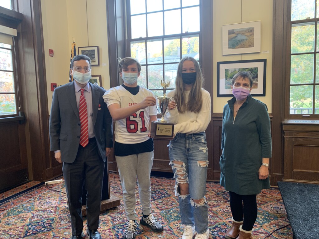 (PHOTO: Rye Mayor Josh Cohn, Spelling Bee Winners Patrick Harrigan and Katelyn Haines, and Rye resident Adrienne Mecca at The Rye Free Reading Room's 4th Annual Spelling Bee on November 11, 2021.)