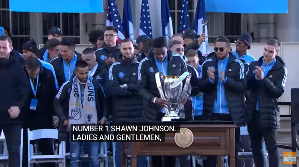 (PHOTO: Rye native James Sands (far right) with his NYCFC teammates at NYC City Hall on December 14th  to celebrate the team's 2021 MLS Cup win.)