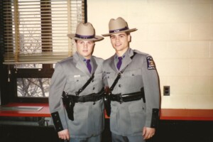 (PHOTO: Kopy, on left, next to his roommate for the trooper academy, Joe Lamarodo, on graduation day in 1987.)