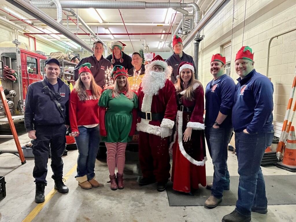 (PHOTO: At the firehouse with Santa, Ms. Claus and one of the Elves on Sunday.)