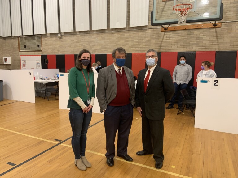 (PHOTO: Rye guy and County boss George Latimer stopped by the Westchester County Vaccine clinic at Rye Middle School on November 19th. He is pictured here with Board of Education President Jennifer Boyle (on left) and Heriberto Contreras, Sr., Coordinator of Community Outreach and Engagement for the Westchester County Department of Health (on right).)