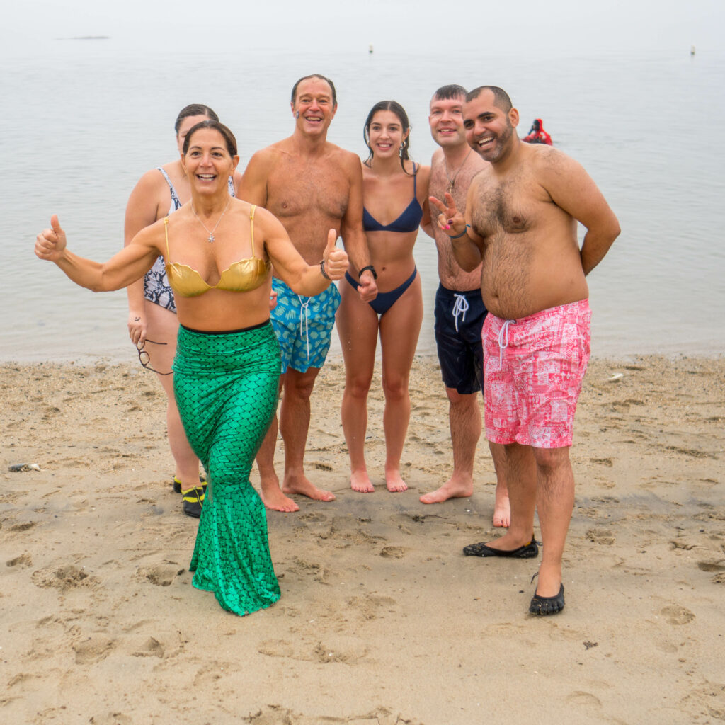 (PHOTO: The 20th Annual Ray’s Polar Bear Plunge on New Year's Day 2022 at Rye Town Park. Credit: Ed Szamborski.)