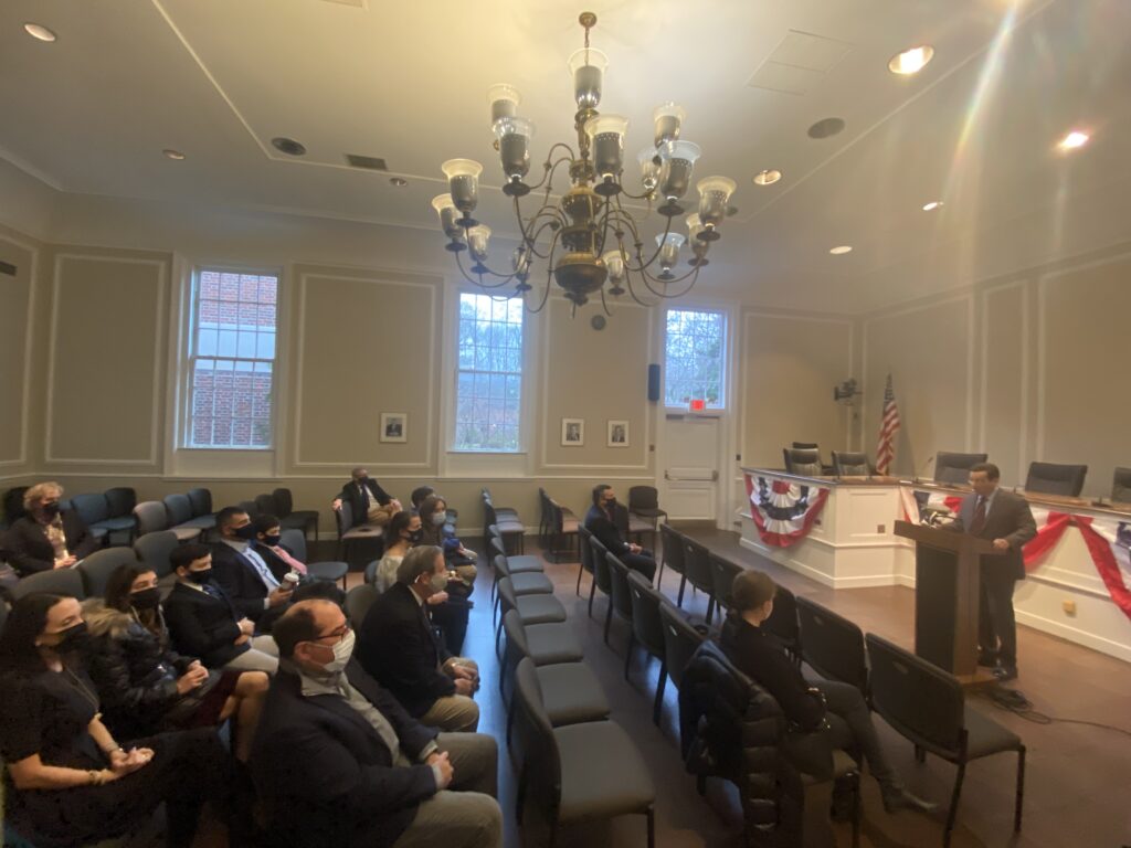 (PHOTO: Mayor Josh Cohn speaking at the swearing in ceremony for new and renewed council members on January 1st, 2022.)