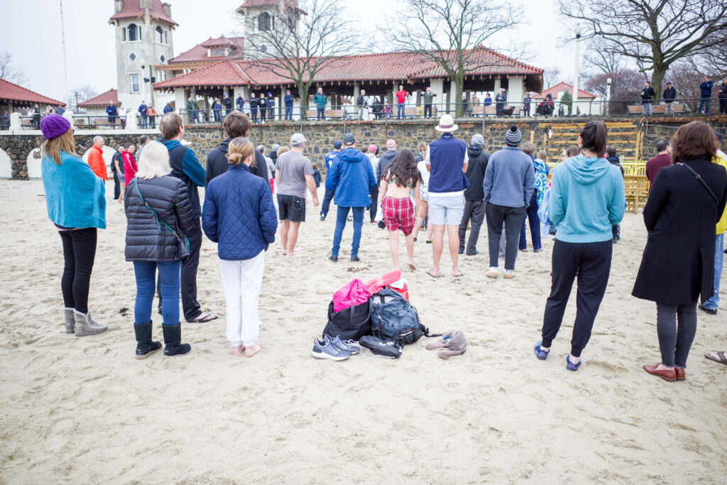 (PHOTO: The 20th Annual Ray’s Polar Bear Plunge on New Year's Day 2022 at Rye Town Park. Credit: Ed Szamborski.)