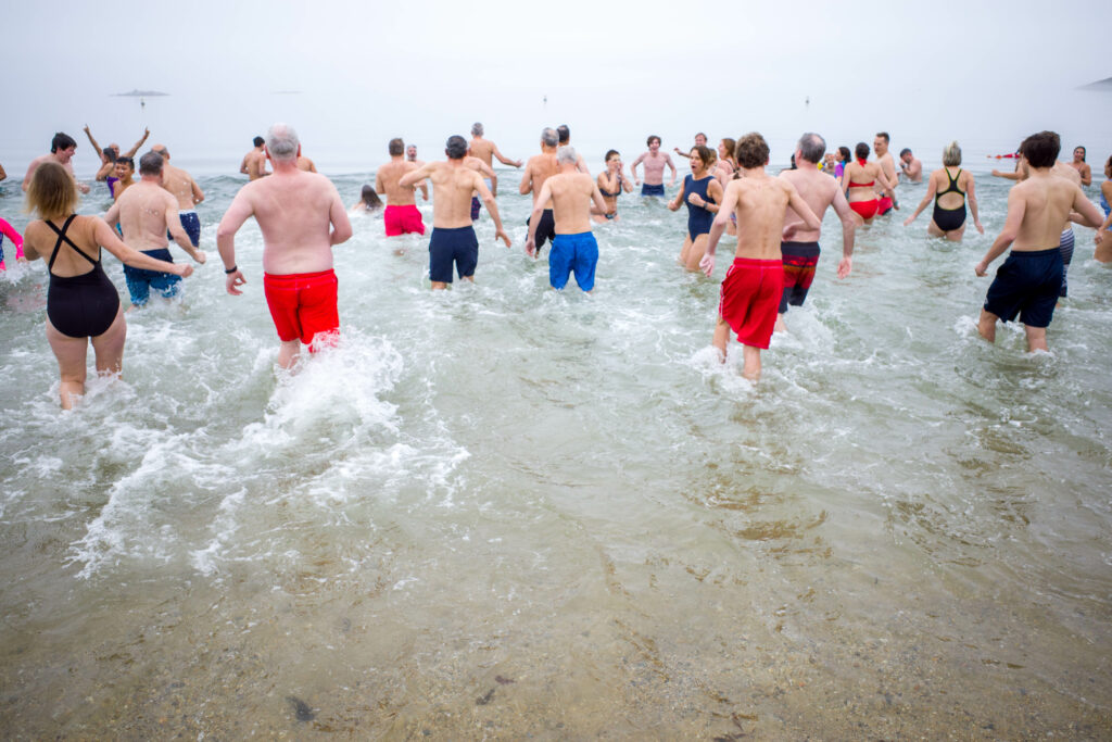 (PHOTO: The 20th Annual Ray’s Polar Bear Plunge on New Year's Day 2022 at Rye Town Park. Credit: Ed Szamborski.)