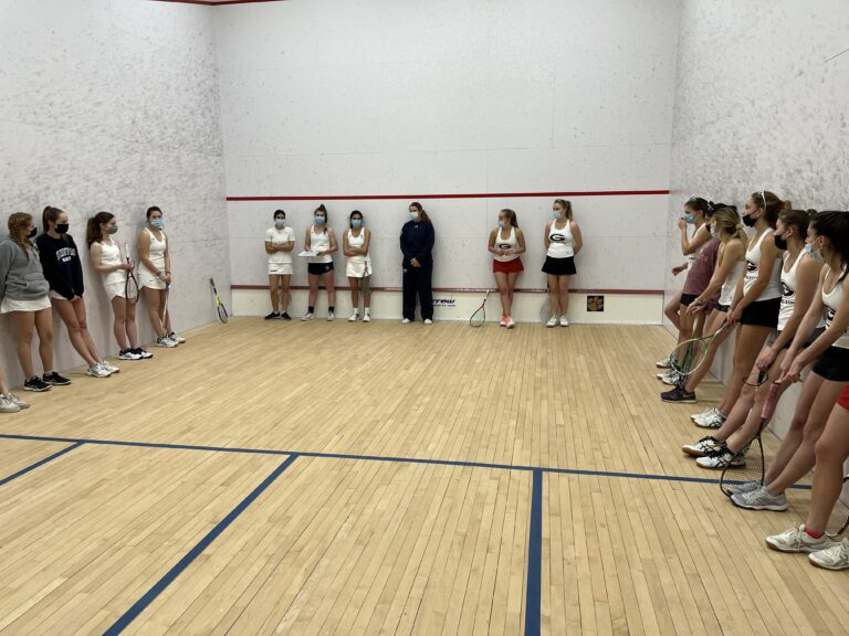 (PHOTO: Rye Country Day and Rye High School Girls Varsity Squash players lineup for intros on Court 2 at RCDS hosted by RCDS coach Natalie Grainger.)