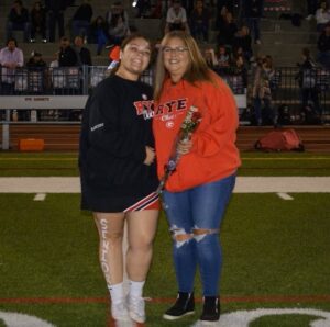 (PHOTO: Rye Girls Cheerleading MVP Chelsea Sanchez with her Mom on senior night.)