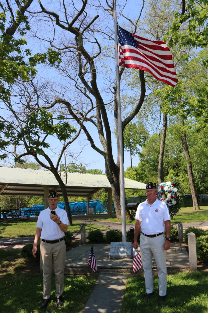 (PHOTO: American Legion Post 128 Commander Frederick de Barros and Finance Officer / Adjutant Tim Moynihan at the John F. Shaughnessy Jr. flagpole at Rye Recreation on Memorial Day.)