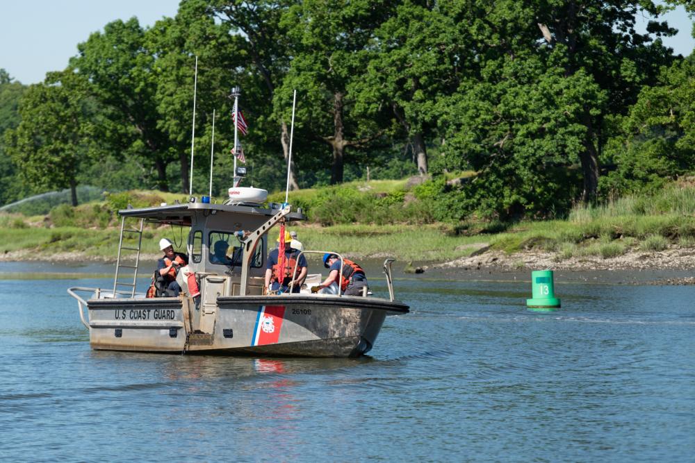 (PHOTO: A Coast Guard Aids to Navigation Team (ANT) New York boat crew temporarily disestablishes buoys from Milton Harbor, New York, June 6, 2022. Due to significant shoaling in the area, the depth of water has become too shallow for Coast Guard crews to regularly access and service the buoys. Private aids to navigation will mark the channel until dredging is complete. Credit: U.S. Coast Guard photo by Petty Officer 3rd Class Ryan Schultz.)