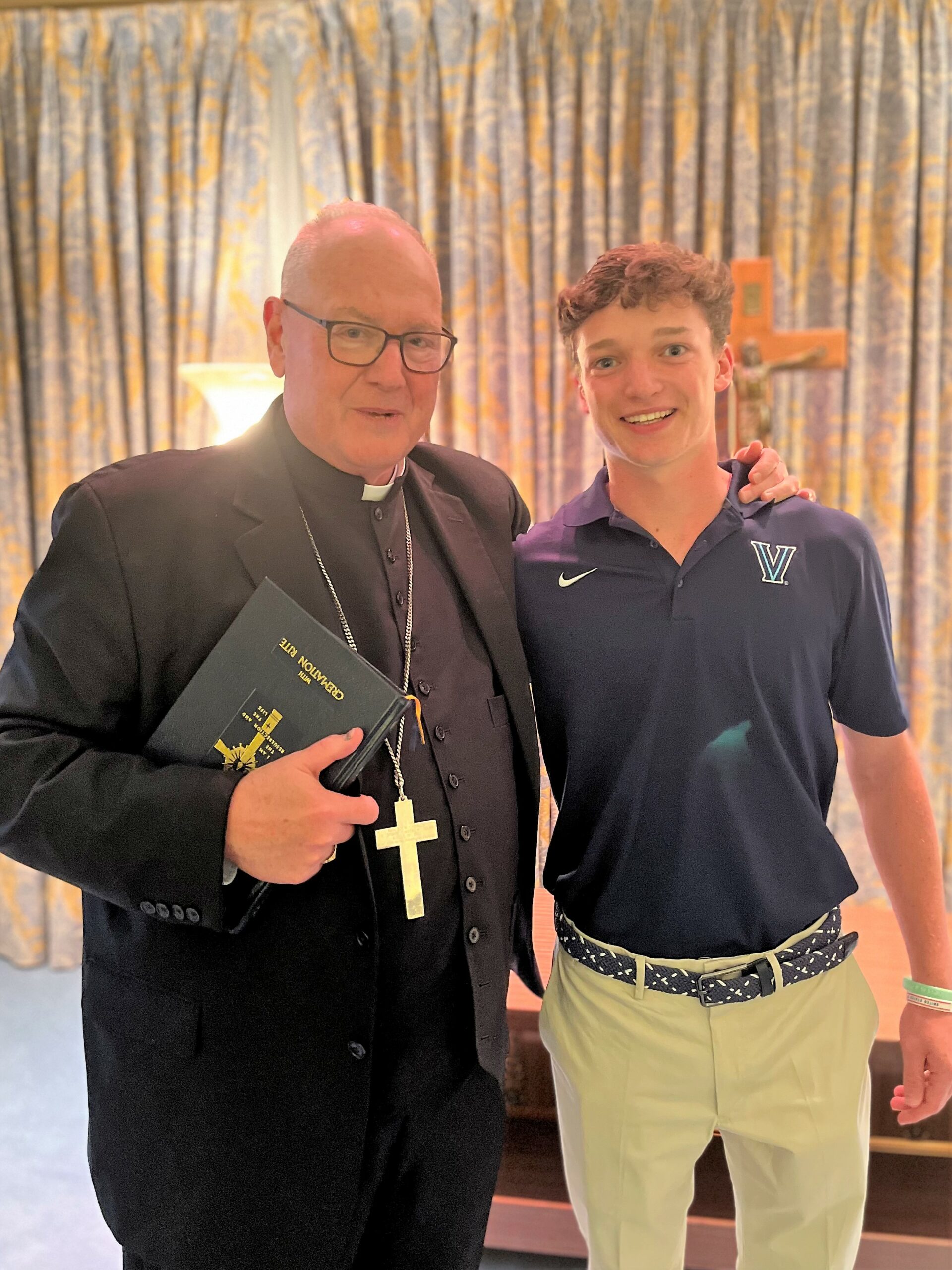 (PHOTO: Cardinal Timothy M. Dolan, who was in Rye for Tom Murphy's funeral service, personally congratulated Michael Lavelle, 18, as the 2022 Resurrection scholarship recipient.)