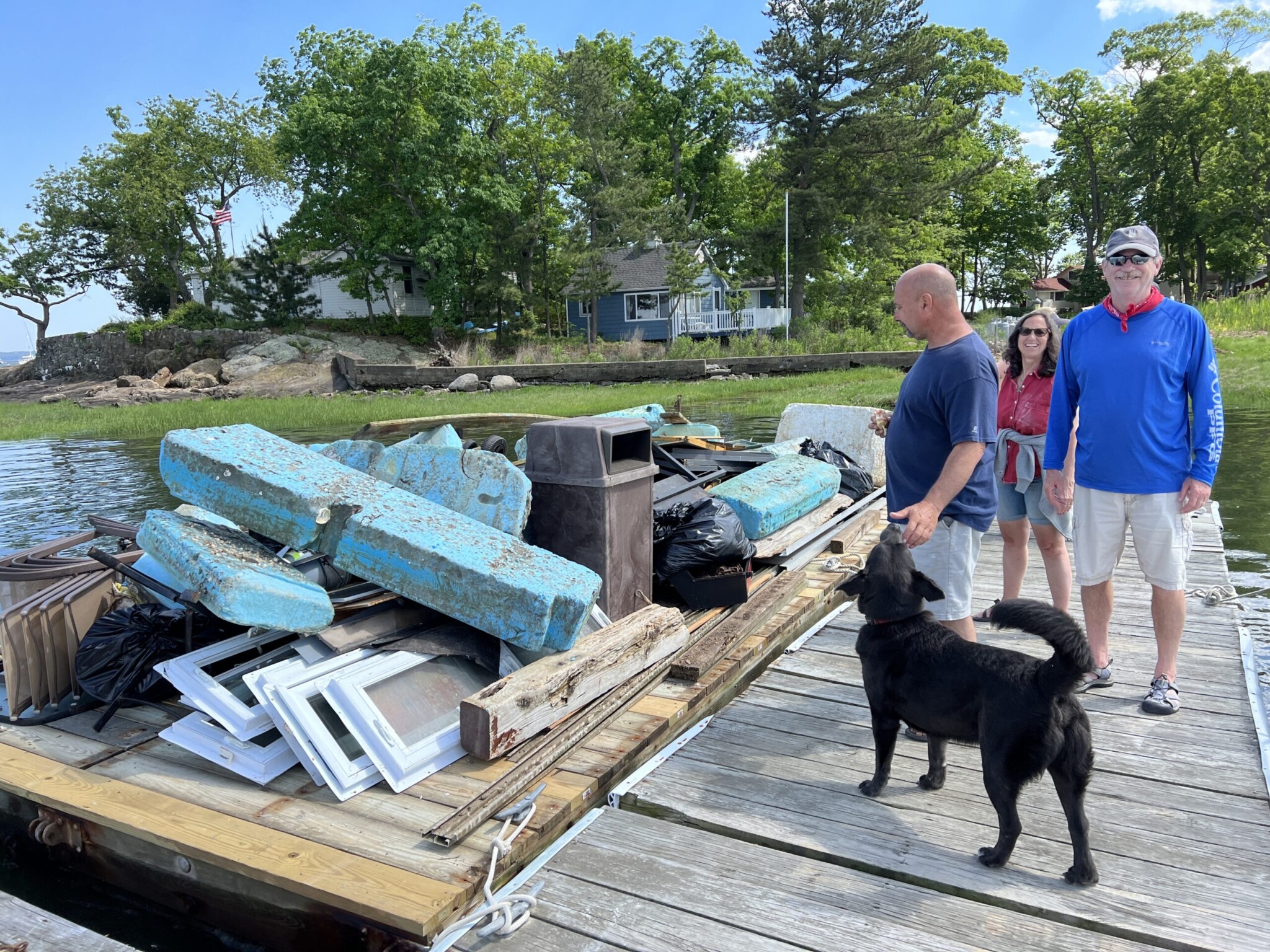 (PHOTO: Holy flotsam and jetsam! Mark Ederer, Roberta Probber and Dave Spader, along with a lot of garbage during the Hen Island cleanup in June. Dog Max is surveying the situation.)er, Jaimian Probber and Dave Spader, along with a lot of garbage during the Hen Island cleanup in June. Dog Max is surveying the situation.)