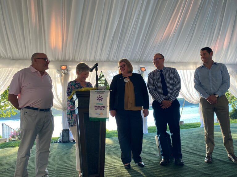 (PHOTO: Rye Rotary officers Bob Manheimer, Lora Hugelmeyer, Michele Thomas, Richard Sgaglio and Richard Flahive at the Wainwright ceremony on June 29, 2022.)