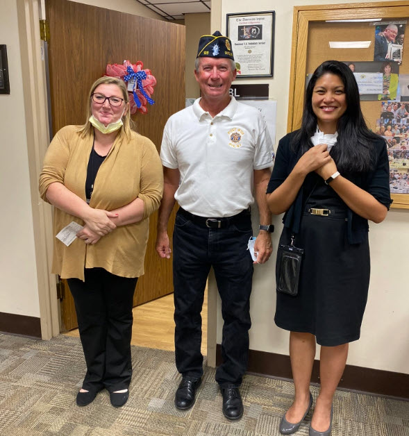 (PHOTO: Tim Moynihan, Finance Officer and Adjutant of Rye American Legion Post 28 (center) presenting the check to Nicole Embry, Chief, Center for Development and Civic Engagement (left) and Kathleen Dupaya-Metallo, Assistant Director of the Hudson Valley VA System (right).)