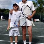 (PHOTO: Michael Collins' son Nate, with his father, Albie, playing tennis at Manursing.)