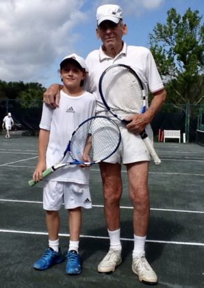 (PHOTO: Michael Collins' son Nate, with his father, Albie, playing tennis at Manursing.)