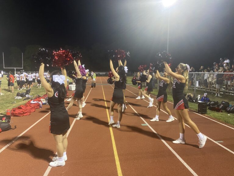 (PHOTO: Girls Varsity Cheerleading was at Cornwall Friday evening alongside Garnet football.)