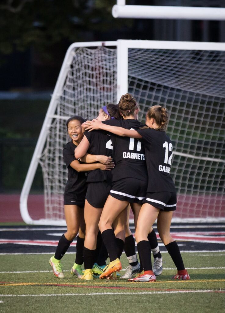 (PHOTO: Rye Celebrates their first goal over Cicero-North Syracuse on Saturday.)