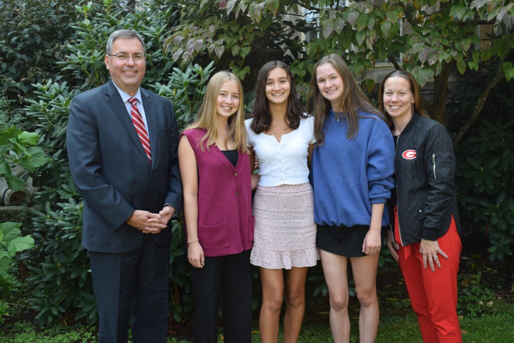 (PHOTO: Rye High School National Merit semifinalists for 2022-23 with school officials (left to right): Superintendent Dr. Eric Byrne, Elizabeth Waters, Julia Cabrera, Cassidy Pagen, and Rye High School Principal Suzanne Short.)