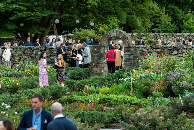 (PHOTO: Guests mingle with native plants in the Jay gardens at the 30th Anniversary Moonlight Soirée on September 17, 2022.)