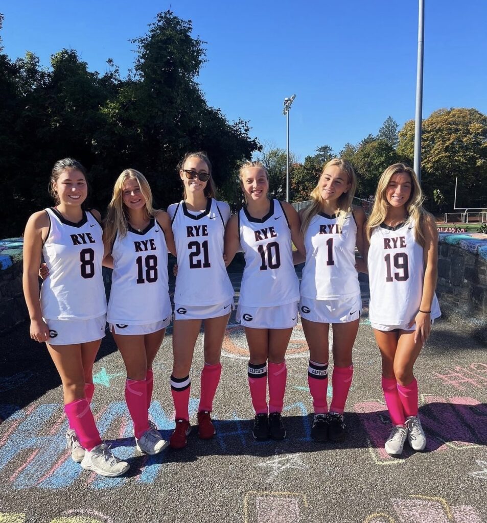 (PHOTO: Rye Girls Field Hockey seniors on Senior Day: #8 Hailey Wilmarth, #18 Charlotte Langer, #21 Shay Ott, #10 Scarlett Karmilowicz, #1 Lily Mann, #19 Ava Chiaravalle.)