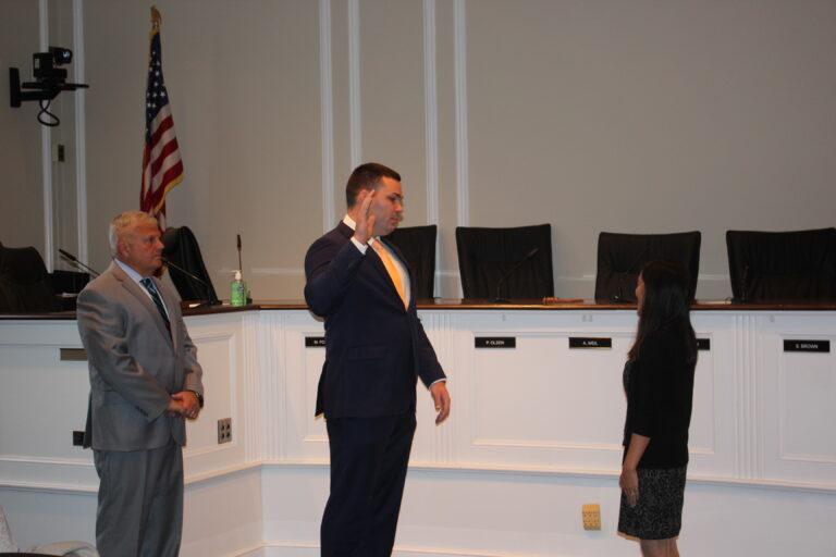 (PHOTO: William X. Draper was sworn in Monday at a Rye City Hall ceremony. Left to right: Public Safety Commissioner Mike Kopy, Draper, Deputy City Clerk Euka Pietrosanti.)