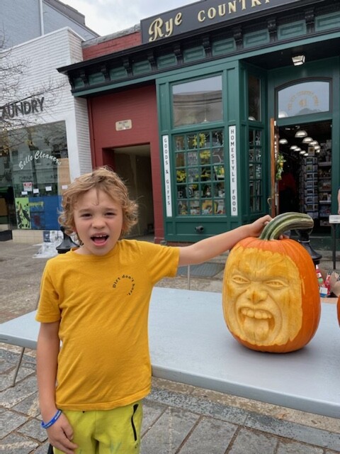 (PHOTO: Midland student Zachary Fry's best effort to resemble his new pumpkin.)