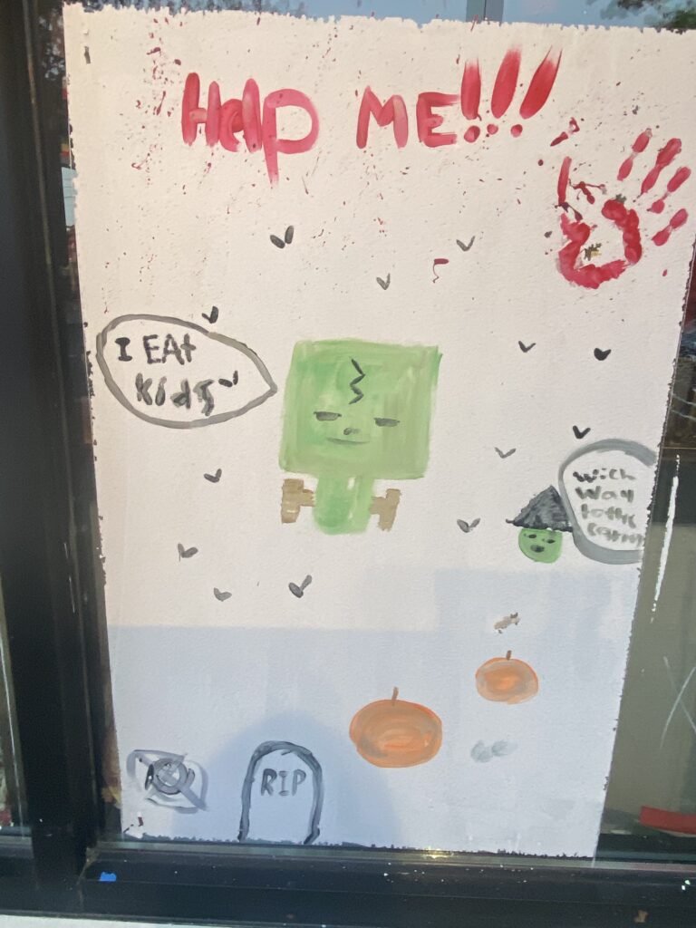 (PHOTO: Artwork from the The 69th Annual Halloween Window Painting on Purchase Street, 2022.)