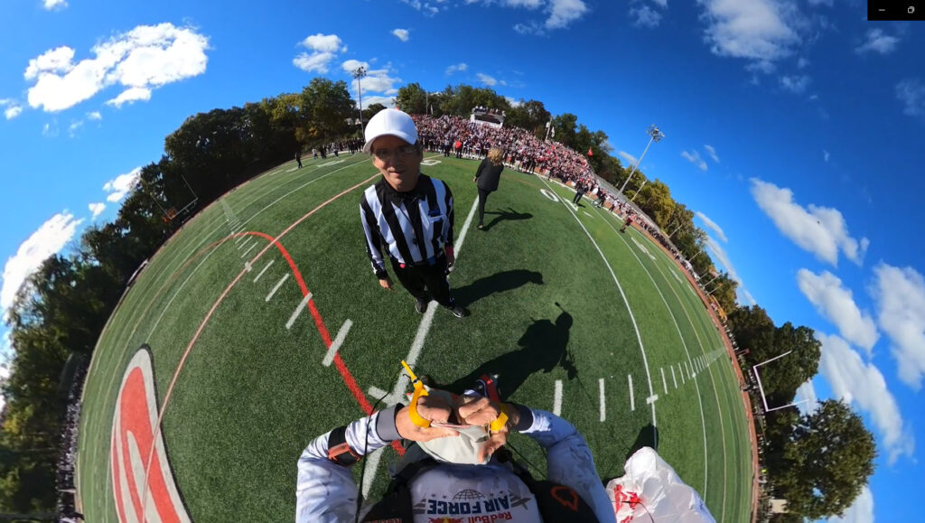 (PHOTO: Mission accomplished, delivering the game ball.)