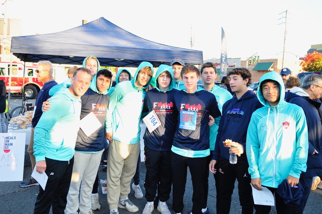 (PHOTO: Members of the Rye High School Soccer team were among the first to arrive for the 5k race. )