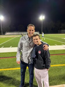 (PHOTO: Rye Boys Varsity Soccer Coach with his cousin Kevin who attended Friday night's game at Nugent and got to celebrate the win with the team.)