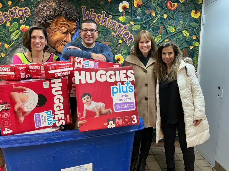 (PHOTO: Rita Tino (far right) and Cathy Garr of Rye Rotary Club (second from right) with staff members of The Carver Center.)