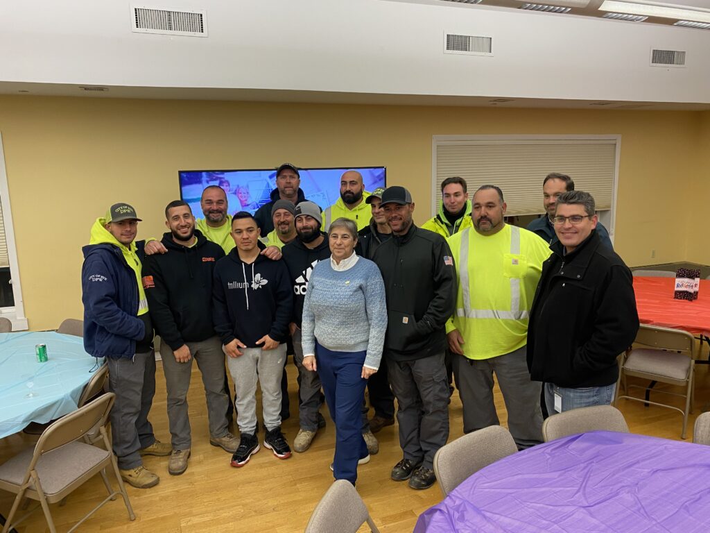 (PHOTO: Rye Rec Superintendent Sally Rogol with the Department of Public Works crew that brought the new amphitheater to reality.)