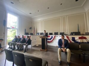 (PHOTO: Commander Fred de Barros of American Legion Post 128 welcomed guests to Veterans Day ceremonies at Rye City Hall on Friday.)