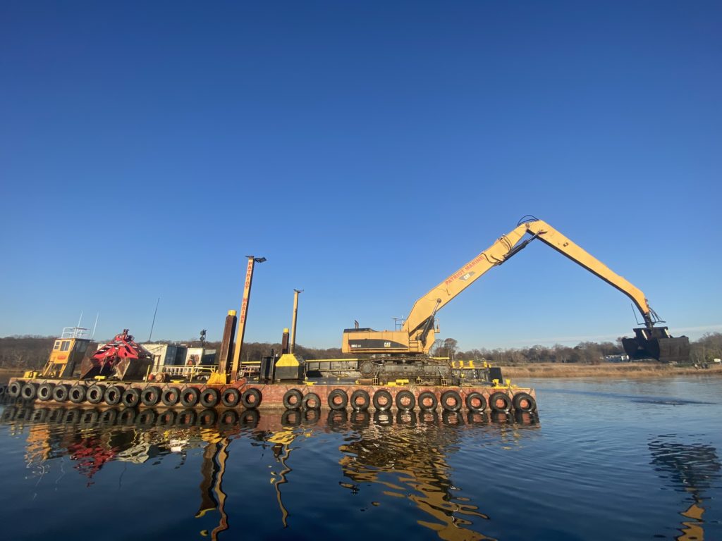 (PHOTO: Dredging operations last Wednesday in Milton Harbor. 21,000 cubic yards of silt is being removed to clear the channel for navigation.)