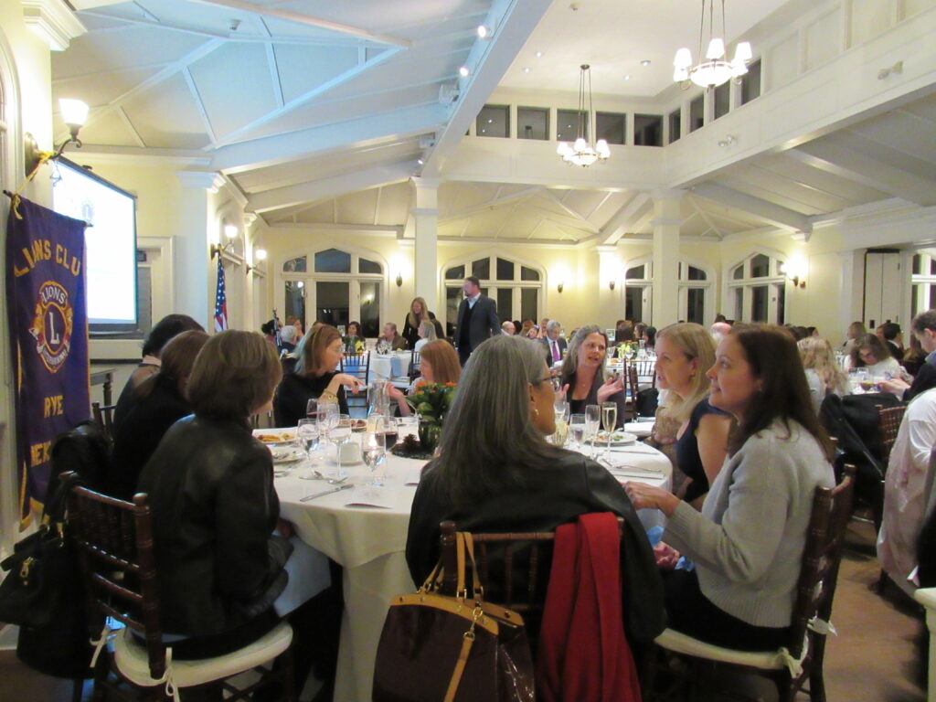 (PHOTO: A full house at Whitby Castle to honor Staci Ramachandran, 2023 recipient of the James A. and Marian M. Shea Community Service Award from the Rye City Lions Club.)